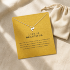Life Is Beautiful Hummingbird Necklace — editorial flatlay [autogen-pdp]