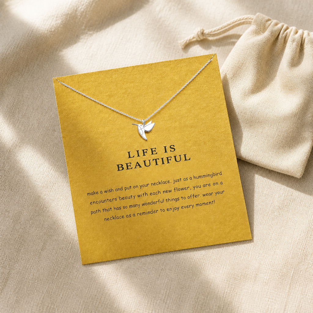 Life Is Beautiful Hummingbird Necklace — editorial flatlay [autogen-pdp]